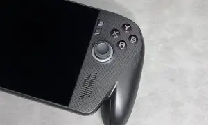 Przenośna konsola do gier, przypominająca Xbox ROG Ally X, z przyciskami A, B, X, Y i analogiem.