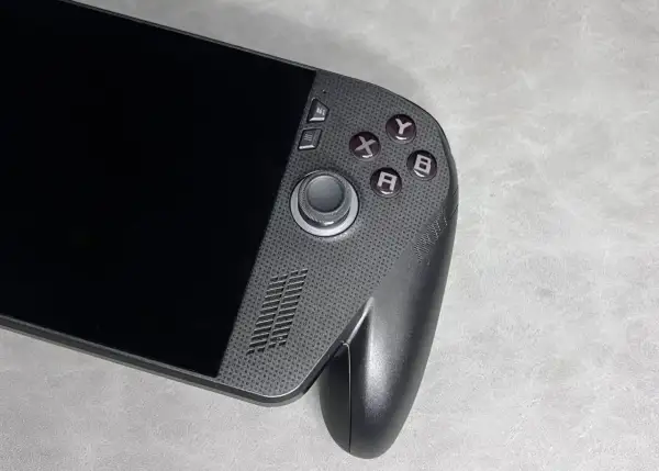 Przenośna konsola do gier, przypominająca Xbox ROG Ally X, z przyciskami A, B, X, Y i analogiem.